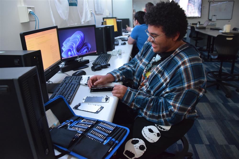 EMCC PC Repair and Network Cabling student works on a computer