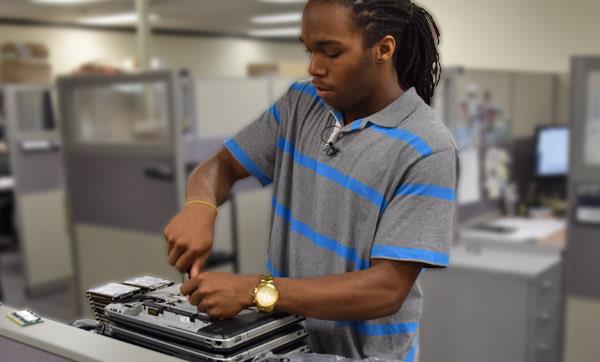EMCC PC Repair and Network Cabling student works on a computer EMCC PC Repair and Network Cabling student works on a computer